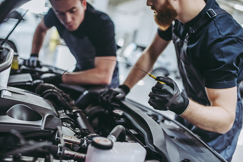 Mechanics Working On A Car