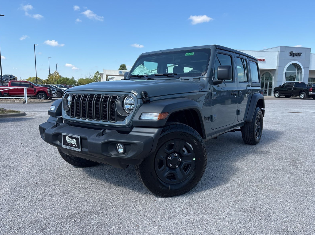2026 Jeep Wrangler with rugged tires, shown outside a dealership in Gatesville, TX