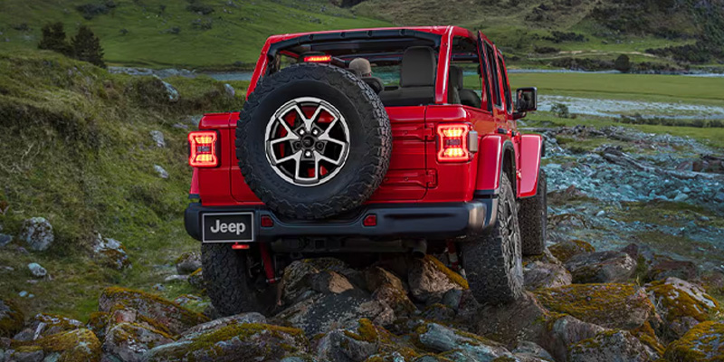 red jeep wrangler off roading