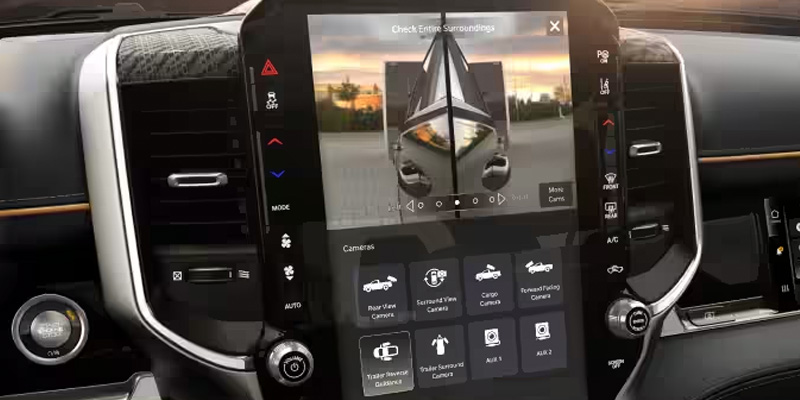 RAM truck infotainment screen displaying surround view and trailer camera assist system.