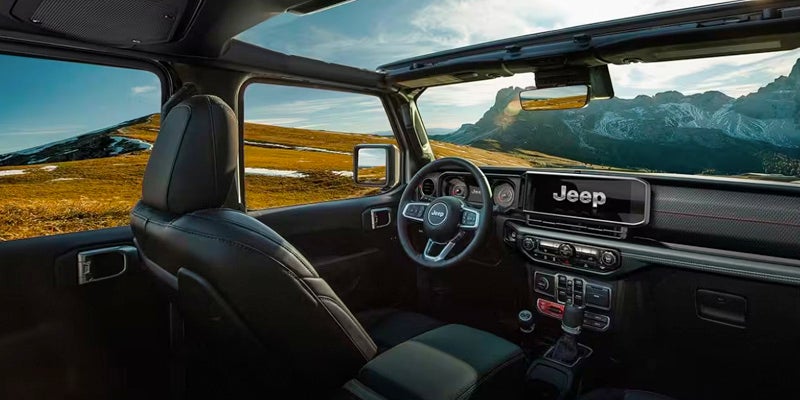 view of driver seat and dashboard of a 2024 jeep wrangler